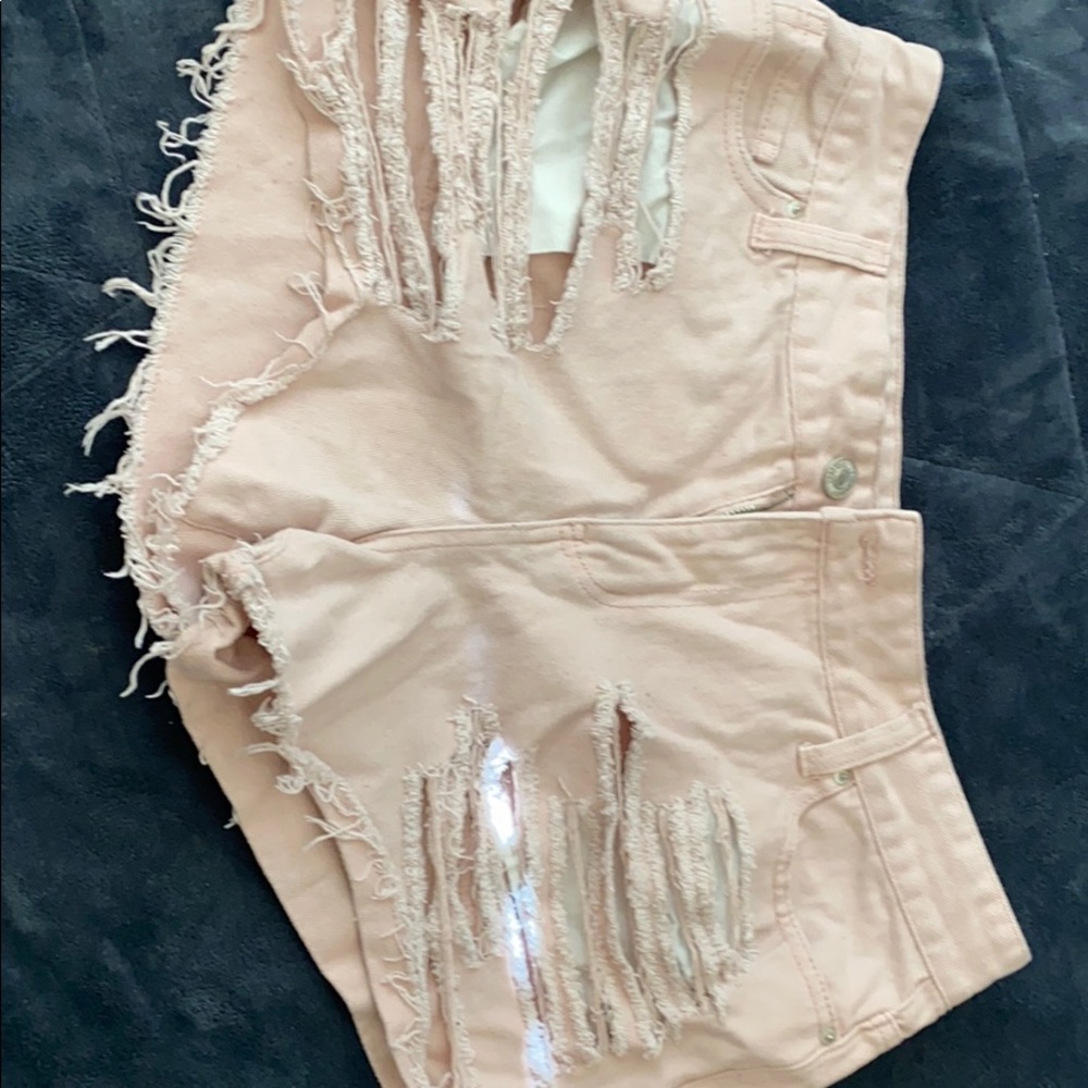 Light pink distressed shorts